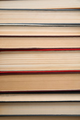 Fototapeta premium Stack of hardcover books as background, closeup