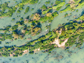 Aerial top down view of 4000 islands Mekong River in Laos, Li Phi waterfalls, famous travel destination backpacker in South East Asia. Braided stream pattern from above.