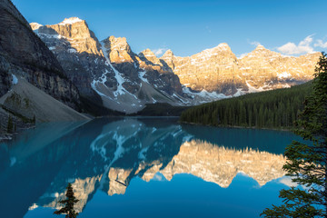 Beautiful sunrise over turquoise water of Moraine lake in the Rocky mountains, Banff National Park, Canada.