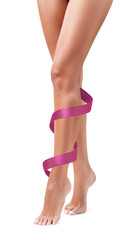 Women's legs with pink ribbon. Physical rehabilitation concept.