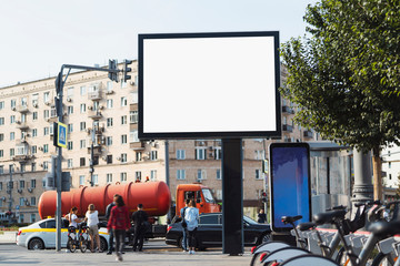 Large horizontal billboard for digital advertisements in city center near subway station and bus...