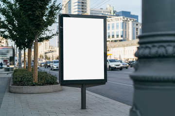 Vertical medium-size billboard with blank display for digital ads and promotional videos. Urban...