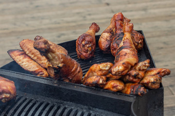 Grilled turkey legs on the grill, street food. Grilled meat, street cafe with turkey meat. Tasty fried meat with toasted crust