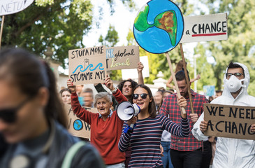 People with placards and amplifier on global strike for climate change.