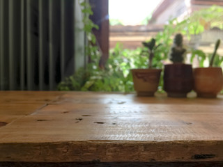 empty wooden table with blurred cafe background.