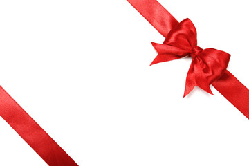 Shiny red satin ribbon on white background
