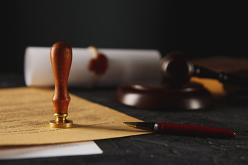Notary's public pen and stamp on testament and last will. Notary public tools.
