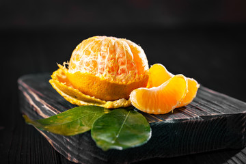 Tangerines on an old fashioned country table. Selective focus. Horizontal.