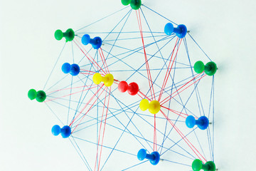 The colored needles are interconnected by a thread, the concept of interaction with each other, and each of them is separately connected with needles of a different color, which are separately connect