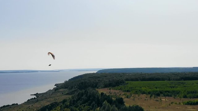 Flight on the ram-air parachute above the land