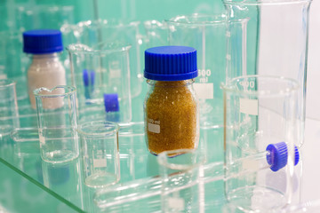 Laboratory equipment, glass flasks and plastic hoses. Research technology.