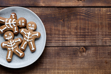 Halloween cookies on wood background, flat lay