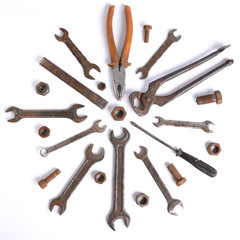 Old rusty stainless steel crescent wrench isolated on white top view