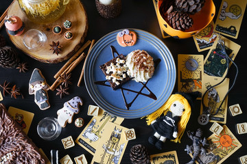 Witch chocolate brownie. Halloween dessert of a chocolate cake brownie in wicca and pegan concept...