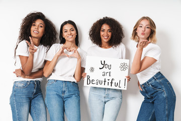 Women multiracial friends holding blank with compliments text.