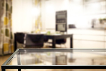 Table background of free space and slim young woman in home interior 