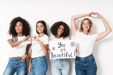 Women multiracial friends holding blank with compliments text. - obrazy, fototapety, plakaty