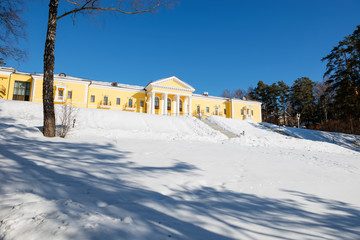 MOSCOW REGION, RUSSIA - MARCH 2, 2019: Country Hotel Bor on a winter day. Located on a hilltop in a coniferous forest on the banks of the river Rozhayka
