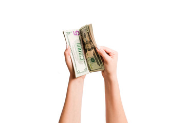 Isolated image of female hands counting dollars on white background. Top view of salary and wages concept