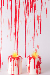 Halloween background with bats, blood and candles.