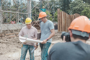 Take pictures in the construction shire being built.