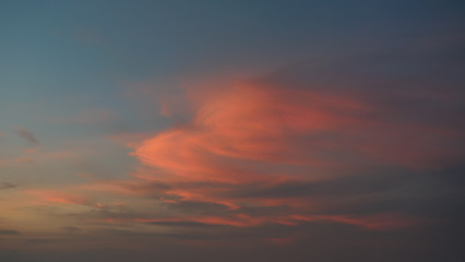 Naklejka na ściany i meble White cotton candy clouds on tropical blue sky at sunset, The horizon began to turn orange with purple and pink cloud at night, Dramatic cloudscape area