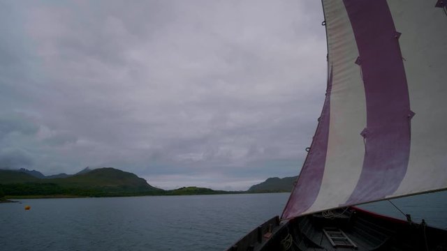 Viking boat sailing in cloudy weather