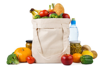 Reusable shopping tote bag full of various groceries. - Powered by Adobe