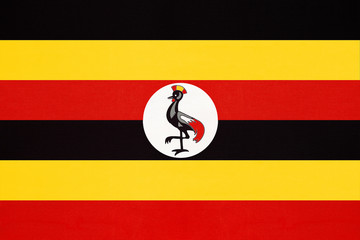 Republic of Uganda national fabric flag, textile background. - obrazy, fototapety, plakaty
