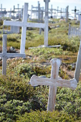 Greenland, Ilulissat, July - graveyard with crosses in the greenlandic tundra - blue sky in the...