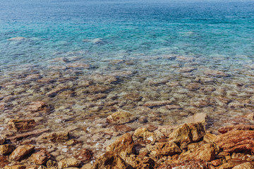 Mediterranean sea rocky shore with turquoise water