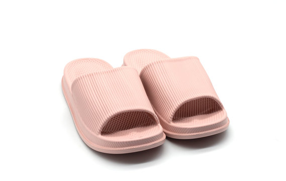 isolated pink rubber slippers on white