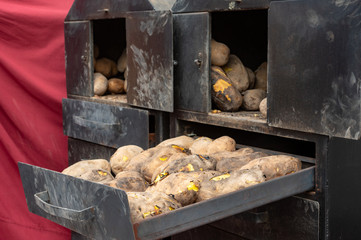 Alcalá de henares, Madrid / Spain. 10.13.2019. Classic-style roast potatoes with firewood