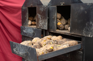 Alcalá de henares, Madrid / Spain. 10.13.2019. Classic-style roast potatoes with firewood