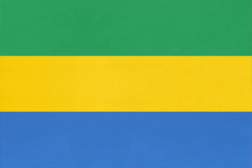Republic of Gabon national fabric flag, textile background. Symbol of african world country.