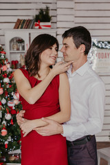 Happy couple celebrating Christmas together .