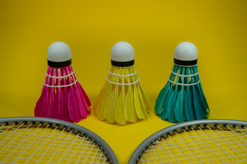 Badminton rackets and feathered shuttlecocks