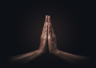 Praying hands with faith in religion and belief in God on dark background. Power of hope or love and devotion. Namaste or Namaskar hands gesture. Prayer position. - obrazy, fototapety, plakaty