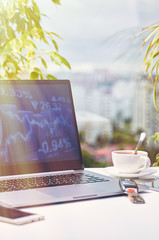 Laptop on a window background on a bright sunny day