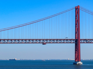 25th April Bridge in Lisbon, Portugal. Famous landmark on river Tagus.