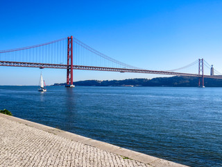 25th April Bridge in Lisbon, Portugal. Famous landmark on river Tagus.