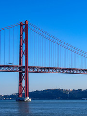 25th April Bridge in Lisbon, Portugal. Famous landmark on river Tagus.