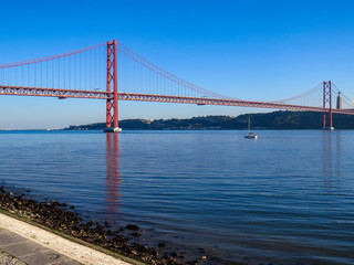 25th April Bridge in Lisbon, Portugal. Famous landmark on river Tagus.