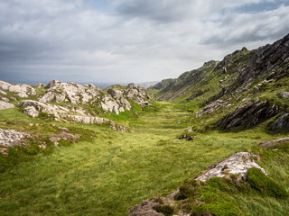 Fototapeta na wymiar Hiking in a valley at mizen head cliffs in ireland