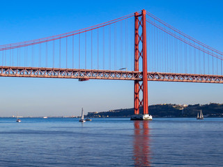 25th April Bridge in Lisbon, Portugal. Famous landmark on river Tagus.