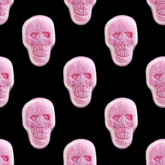 Sweet pink edible marmalade human skull isolated on black background. Photographic collage,...