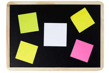 The white note paper and colorful sticky notes on black board isolated on white background with...