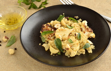 Baked cauliflower, quinoa and hazelnut salad