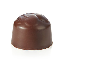 Beautiful chocolate candy without wrapper isolated on white background. Sharpness throughout the frame.