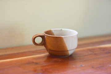 cup of coffee on wooden table